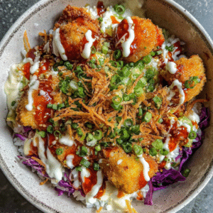 crispy bang bang chicken bowl with creamy toppings