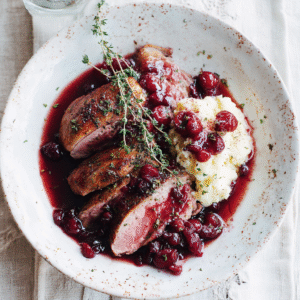 savoring the richness of duck with cherry port sauce